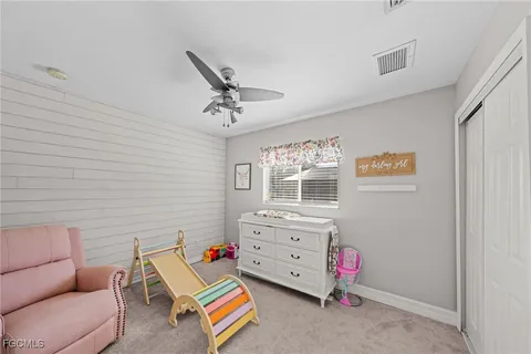 a room with furniture and white walls