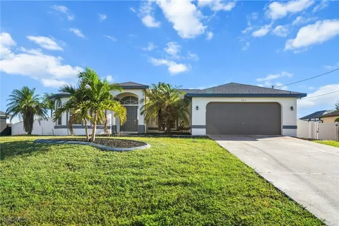 a front view of a house with garden