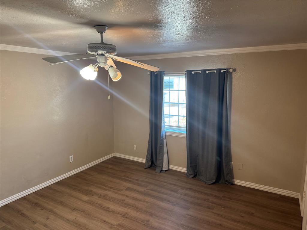 2125 Kings Road Carrollton, TX 75007 - Photo 14 of 33 wooden floor in an empty room with a window