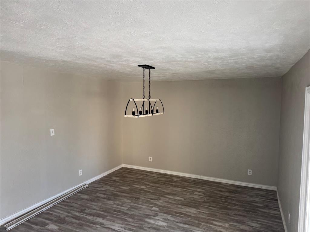 2125 Kings Road Carrollton, TX 75007 - Photo 21 of 33 a view of a room with wooden floor and ceiling fan