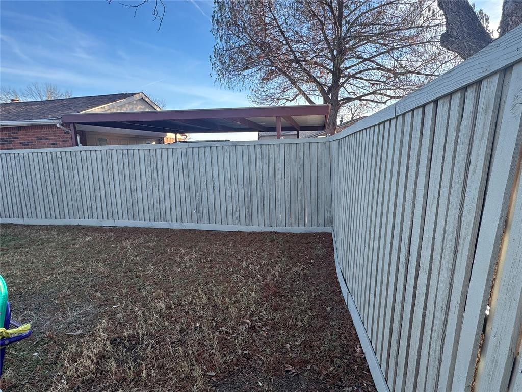 2125 Kings Road Carrollton, TX 75007 - Photo 28 of 33 a view of a backyard with wooden fence