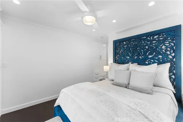 a bedroom with a bed and lamp