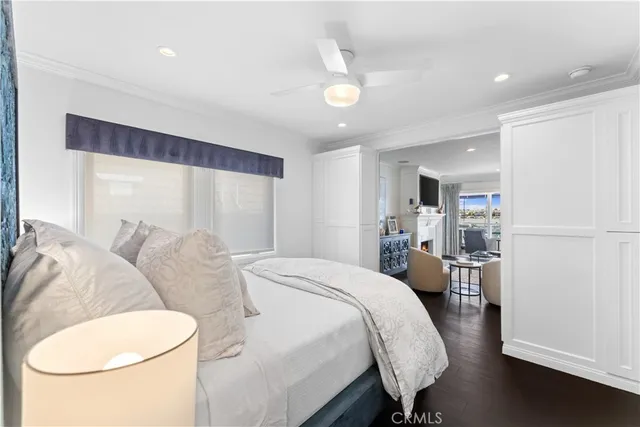 a bed room with a bed and a chair