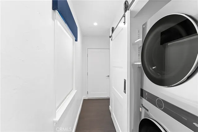 a view of livingroom with washer and dryer