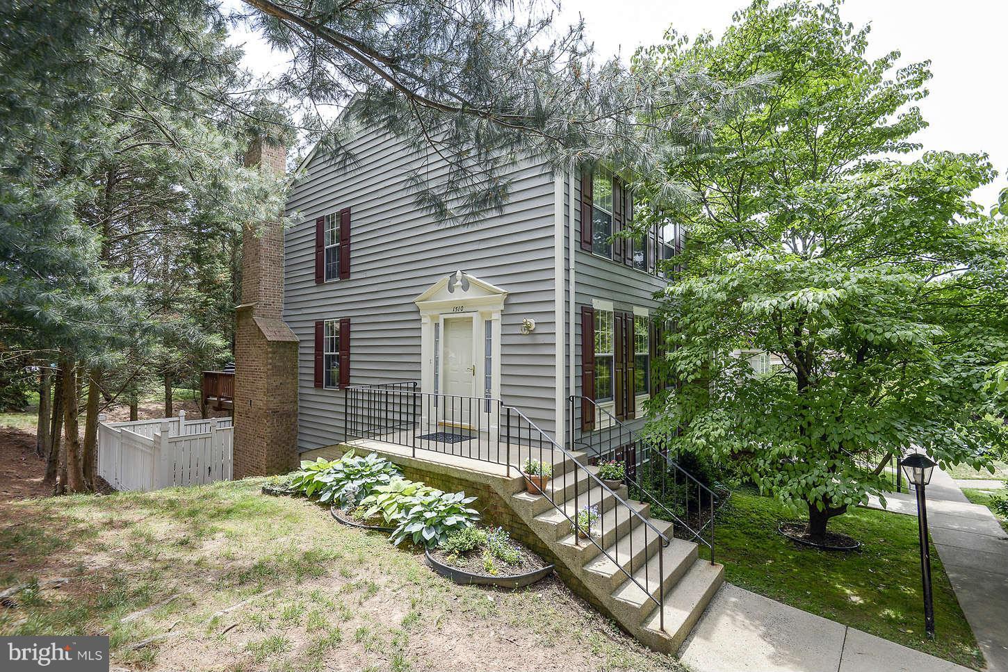 1510 Autumn Ridge Circle Reston, VA 20194 - Photo 1 of 16 a front view of a house with garden