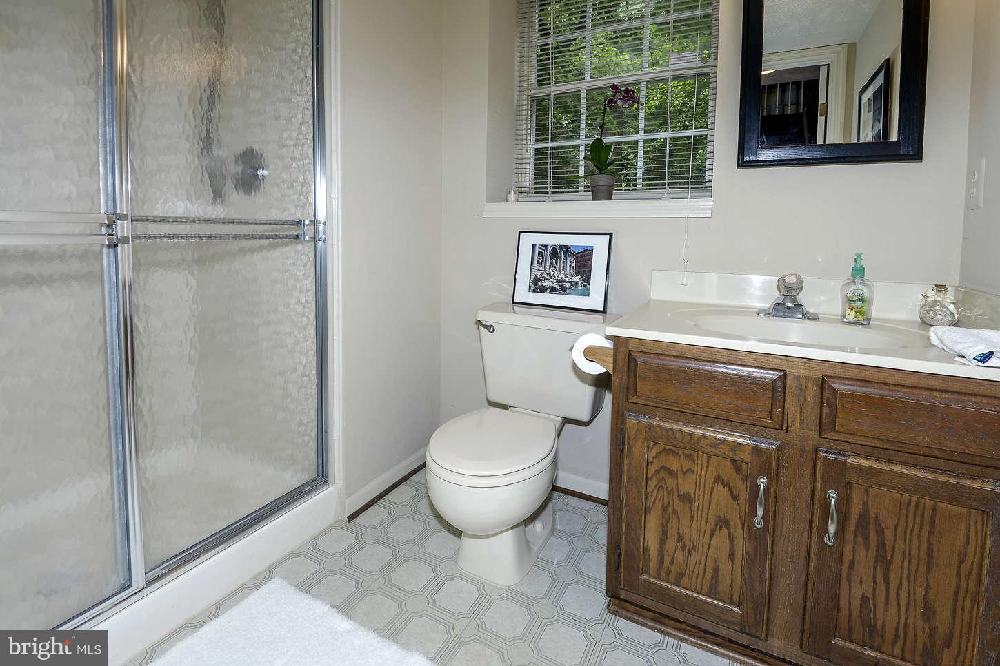 1510 Autumn Ridge Circle Reston, VA 20194 - Photo 13 of 16 a bathroom with a granite countertop sink mirror vanity and toilet