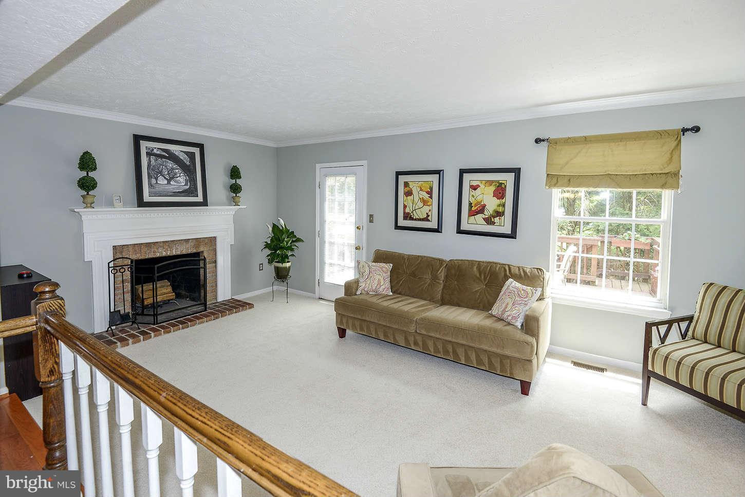 1510 Autumn Ridge Circle Reston, VA 20194 - Photo 5 of 16 a living room with furniture and a fireplace
