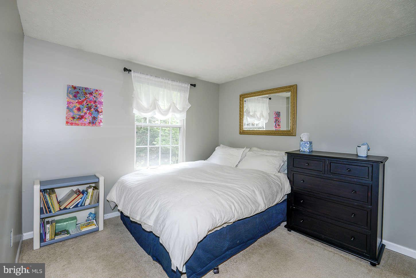 1510 Autumn Ridge Circle Reston, VA 20194 - Photo 9 of 16 a bedroom with a bed and a window