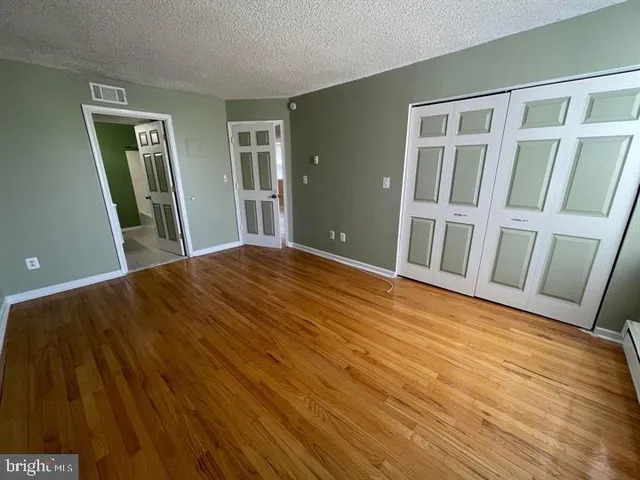 a view of front door with wooden floor