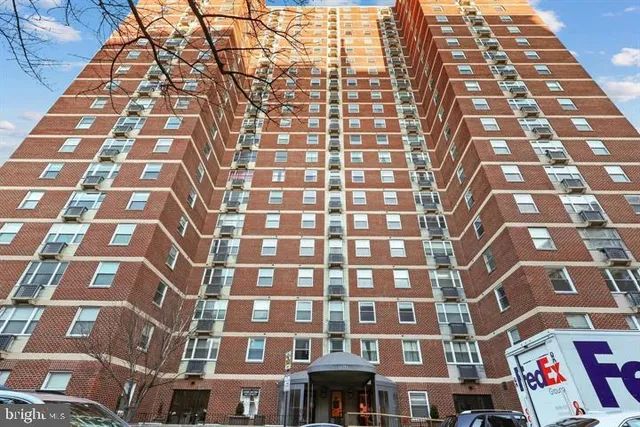 a front view of a building with retail shops