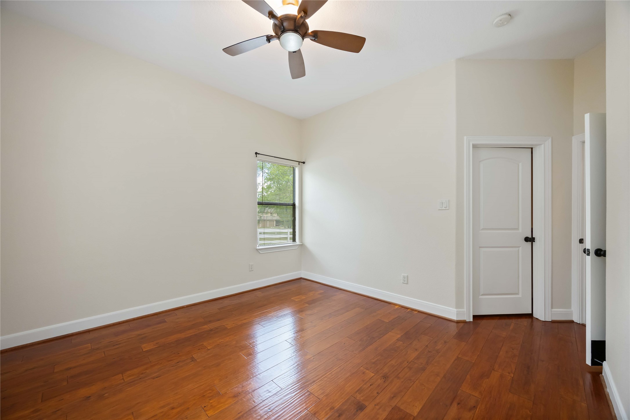 1809 St Beulah Chapel Road Montgomery, TX 77316 - Photo 20 of 50 an empty room with wooden floor fan and windows