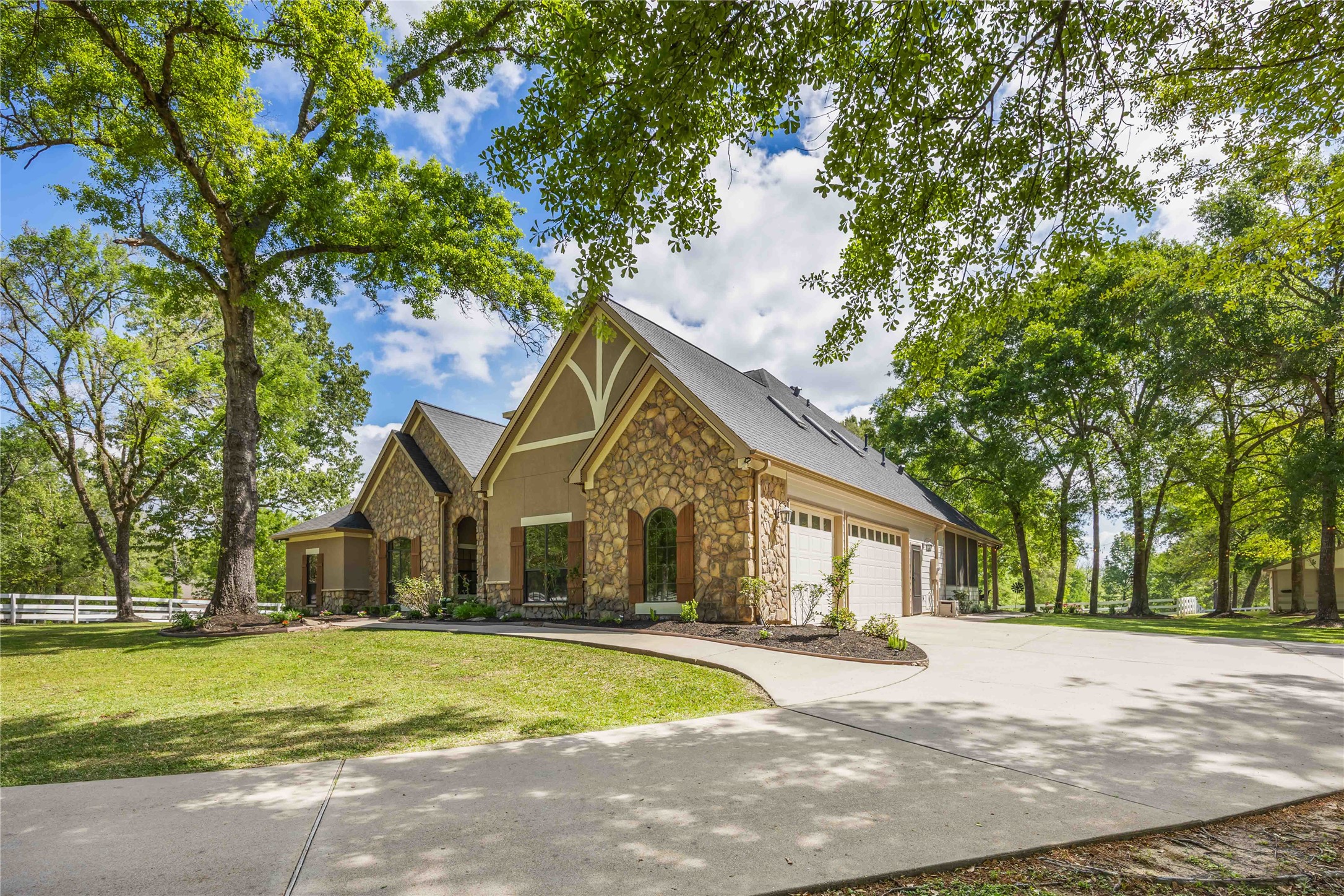 1809 St Beulah Chapel Road Montgomery, TX 77316 - Photo 2 of 50 a front view of a house with a garden and trees