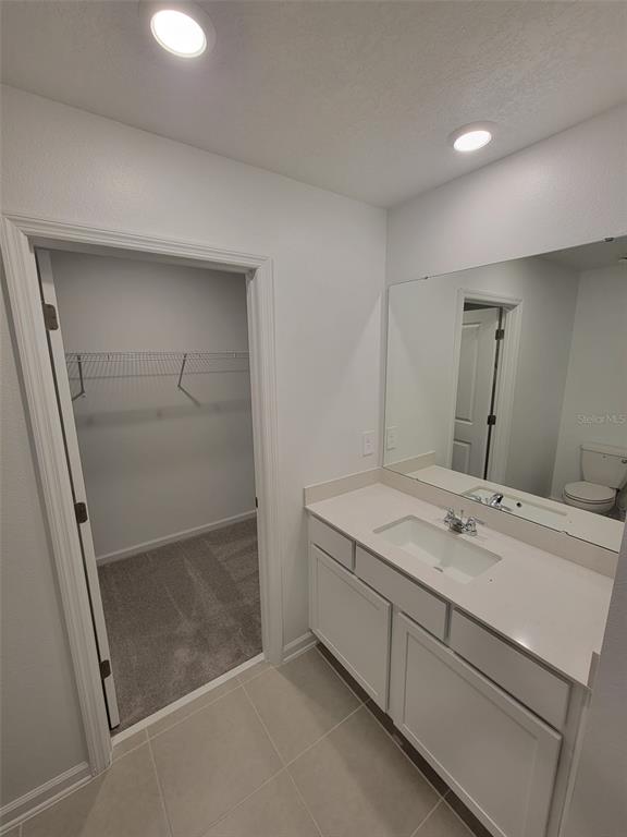 3147 Totem Road Eagle Lake, FL 33839 - Photo 11 of 18 a bathroom with a sink a mirror and a shower