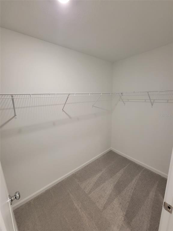 3147 Totem Road Eagle Lake, FL 33839 - Photo 12 of 18 a view of a room with racks on the wall