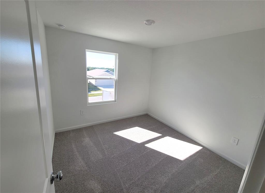3147 Totem Road Eagle Lake, FL 33839 - Photo 13 of 18 an empty room with windows