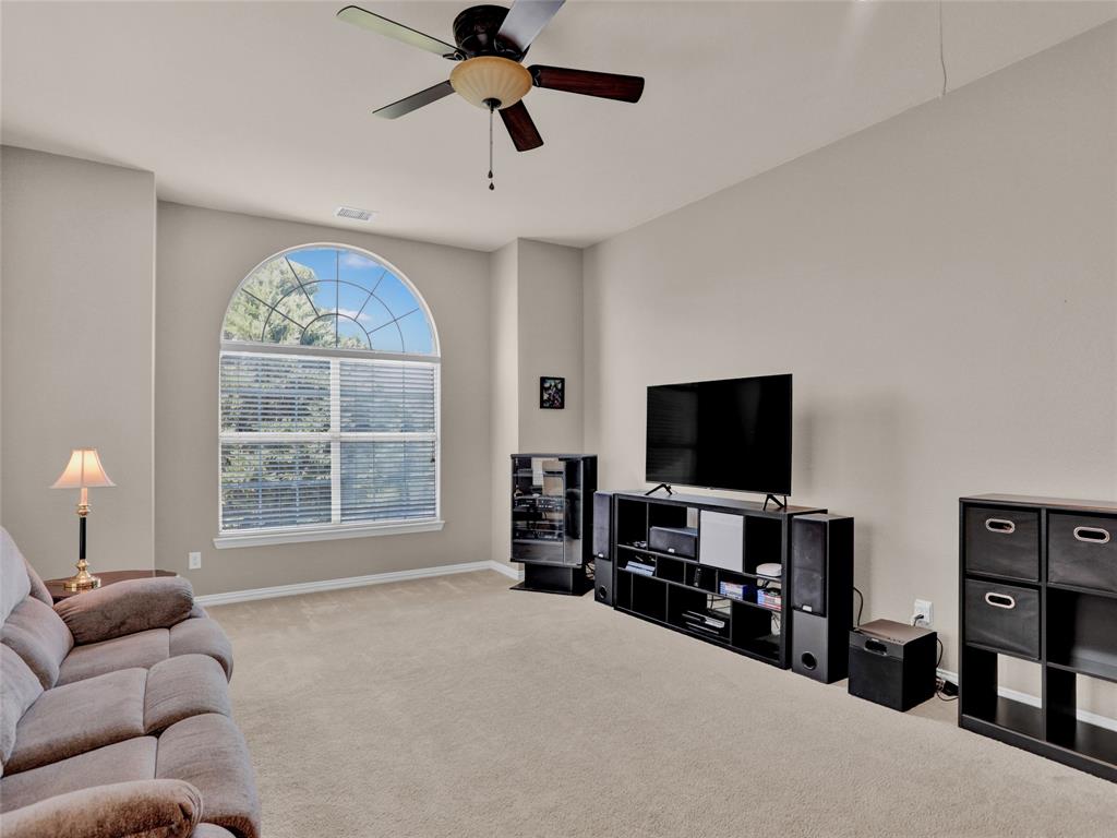 2017 Country Brook Lane Allen, TX 75002 - Photo 17 of 36 a living room with furniture and a flat screen tv