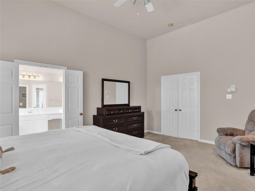 2017 Country Brook Lane Allen, TX 75002 - Photo 19 of 36 a bedroom with a bed and a dresser