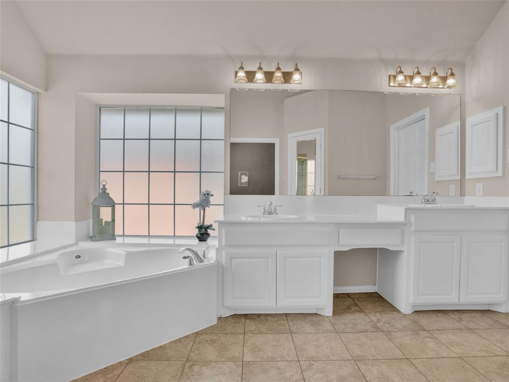 2017 Country Brook Lane Allen, TX 75002 - Photo 21 of 36 a bathroom with a sink vanity and mirror