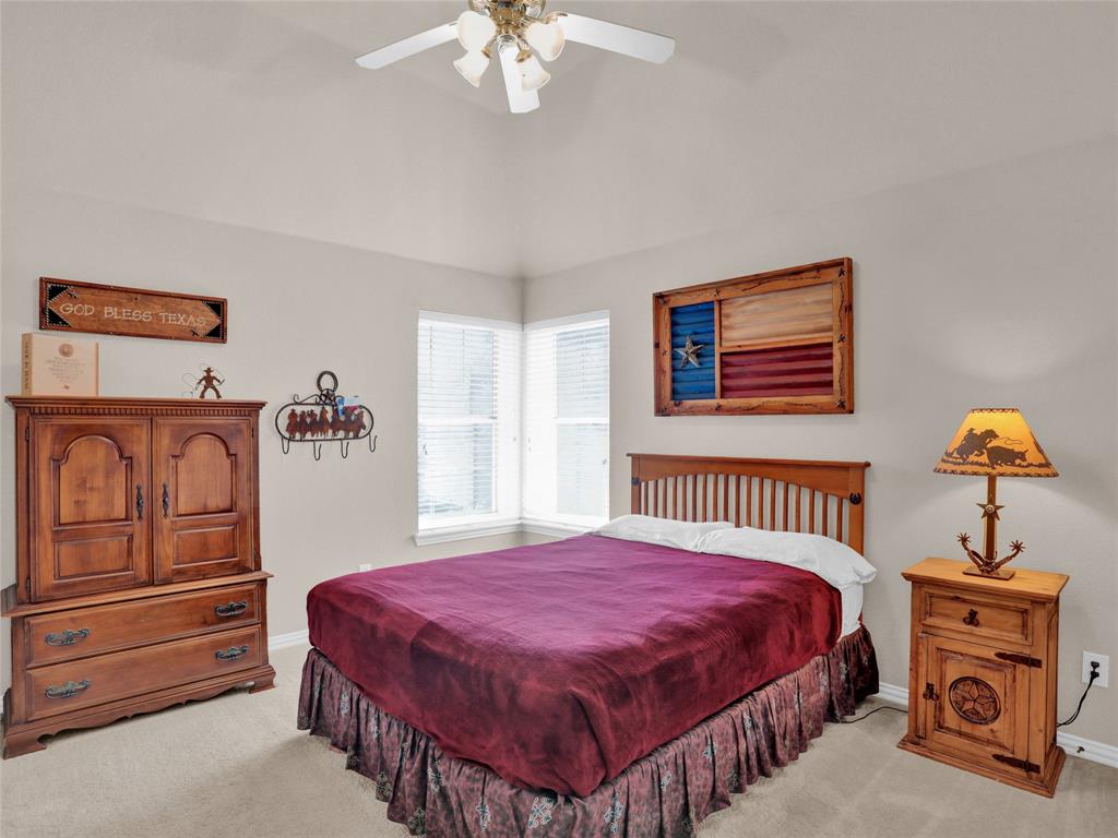 2017 Country Brook Lane Allen, TX 75002 - Photo 24 of 36 a bedroom with a bed a dresser and window