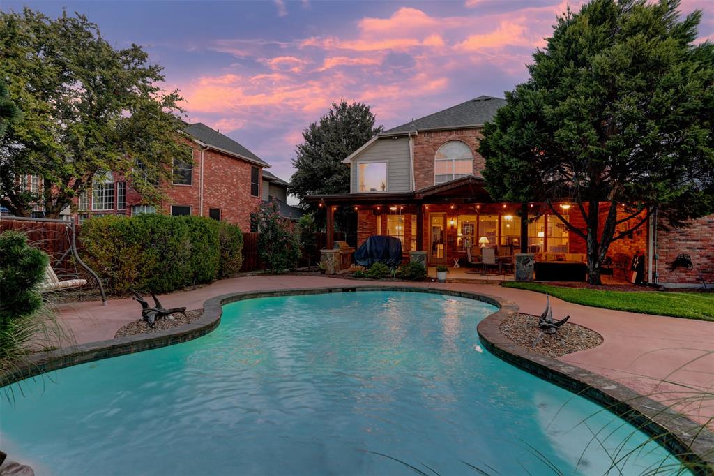 2017 Country Brook Lane Allen, TX 75002 - Photo 32 of 36 a swimming pool with outdoor seating and yard