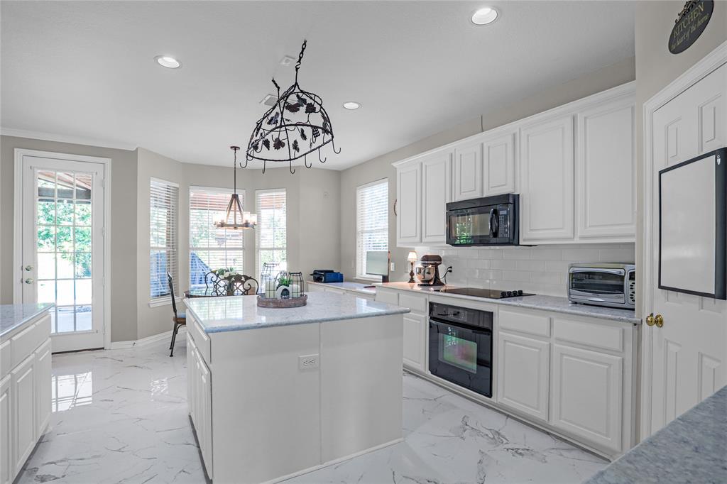 2017 Country Brook Lane Allen, TX 75002 - Photo 8 of 36 a kitchen with appliances a sink and cabinets