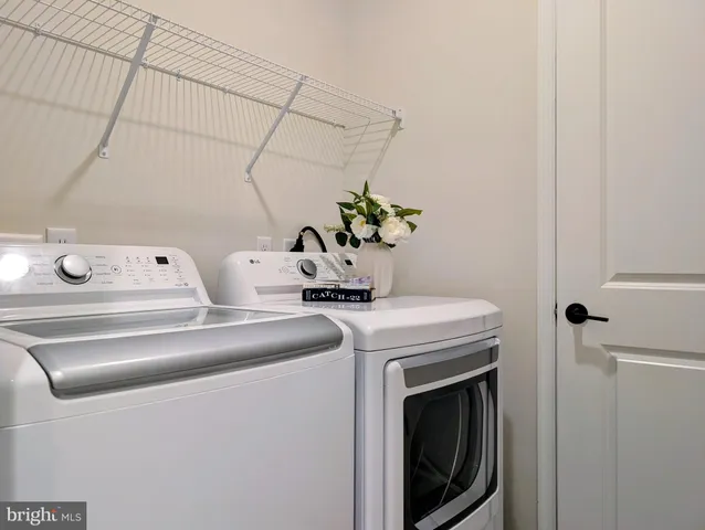 a bedroom with a bed and a lamp