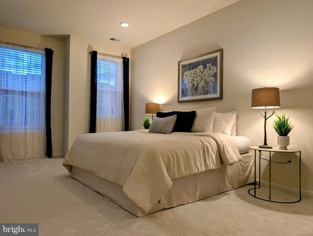 a bedroom with a bed and wall painting