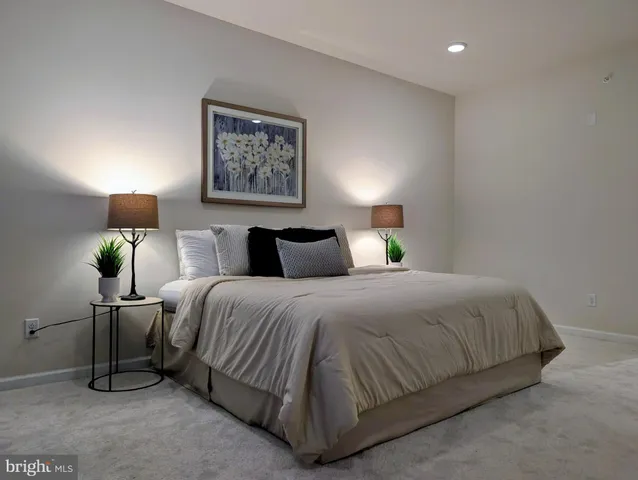 a room with two sinks and a chandelier