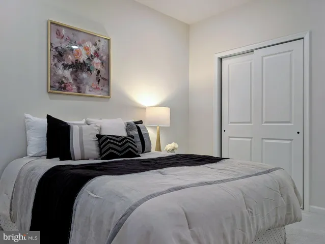 a room with furniture and potted plant