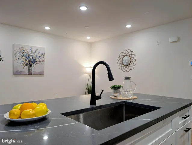 a kitchen with a sink and a stove