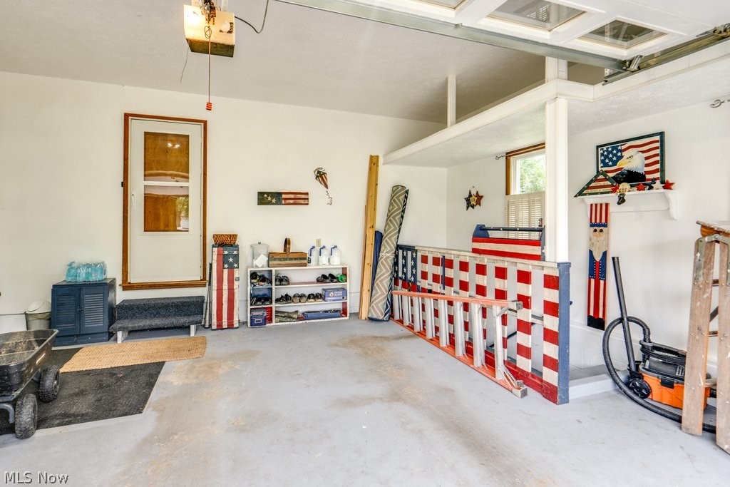531 Porter Road Atwater, OH 44201 - Photo 39 of 44 Garage featuring a garage door opener