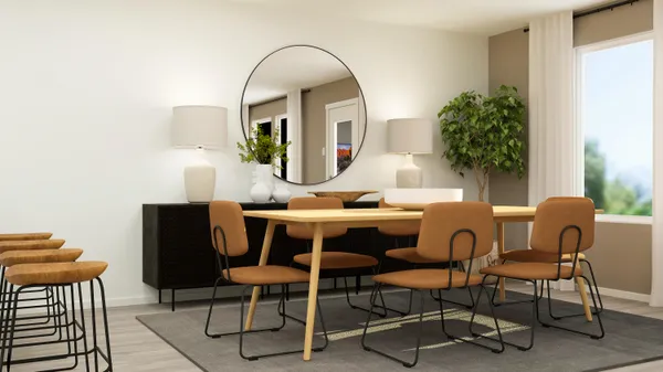 a view of a dining room with furniture and window