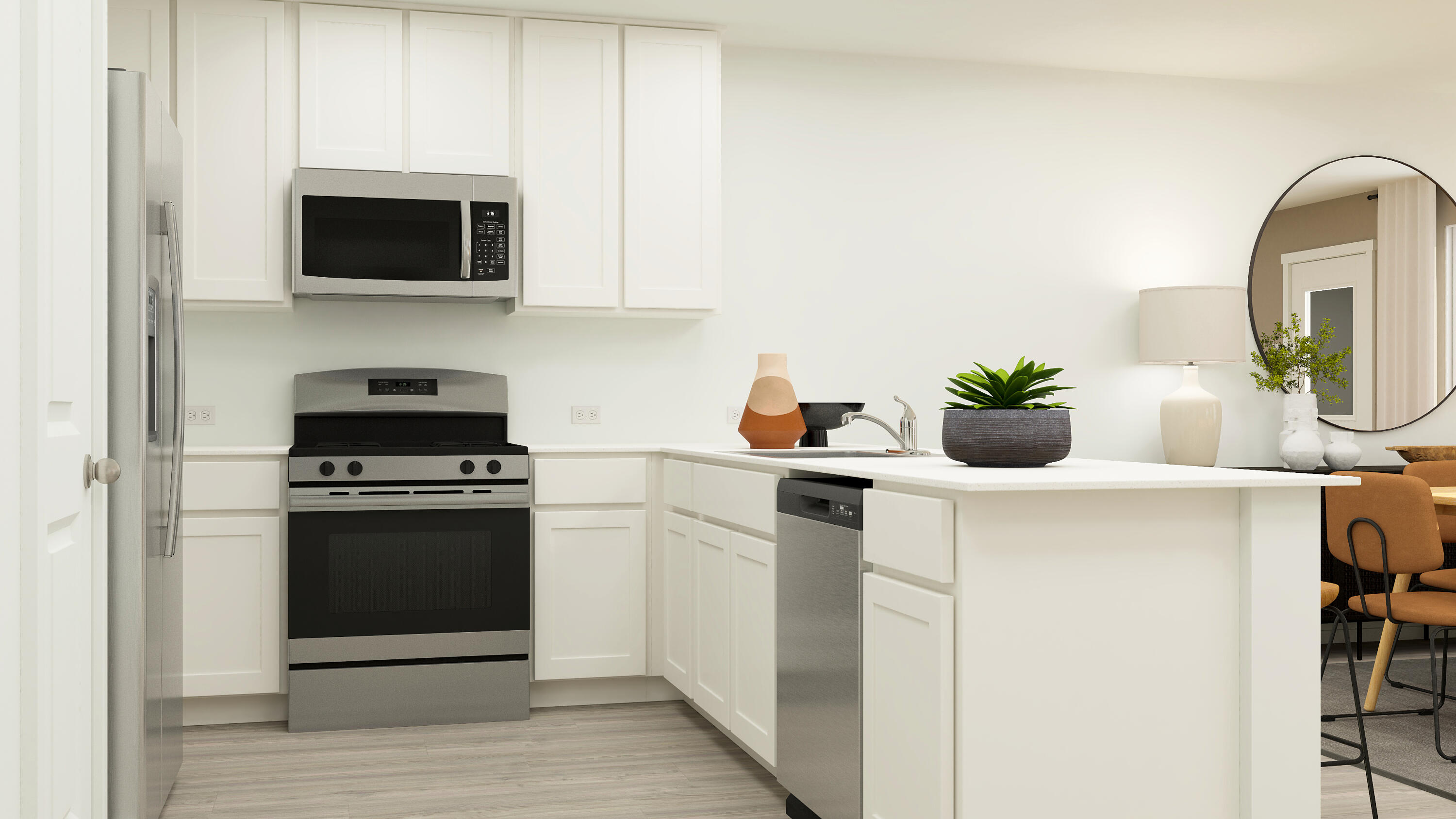 2109 Edgewood Street Lubbock, TX 79403 - Photo 17 of 30 a kitchen with stainless steel appliances a stove a microwave and a white cabinets