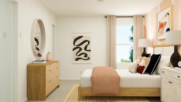 a bedroom with bed and wooden floor