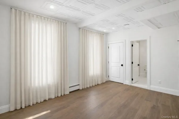 a view of a livingroom with wooden floor