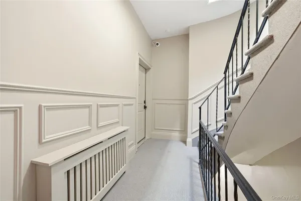 a view of an entryway with wooden floor