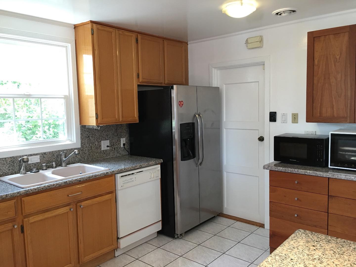 808 Ellis Drive Daly City, CA 94015 - Photo 12 of 45 a kitchen with a sink stove and refrigerator