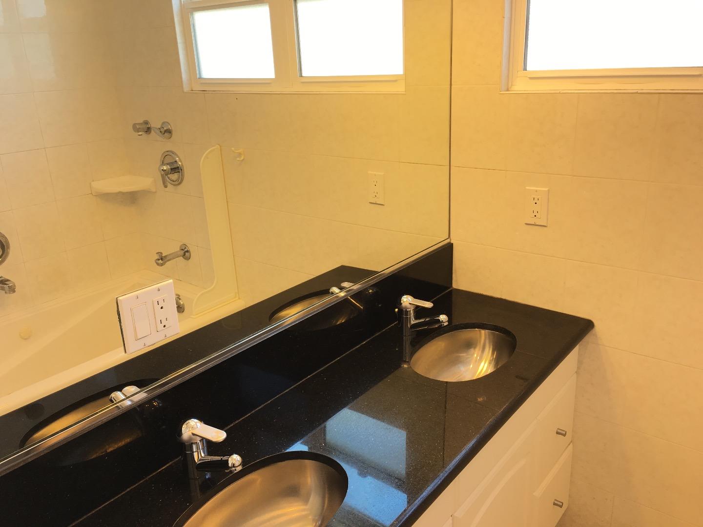 808 Ellis Drive Daly City, CA 94015 - Photo 18 of 45 a bathroom with a sink and a mirror