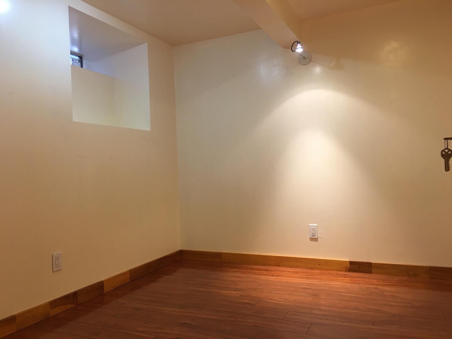 808 Ellis Drive Daly City, CA 94015 - Photo 32 of 45 a view of an empty room with wooden floor and a window
