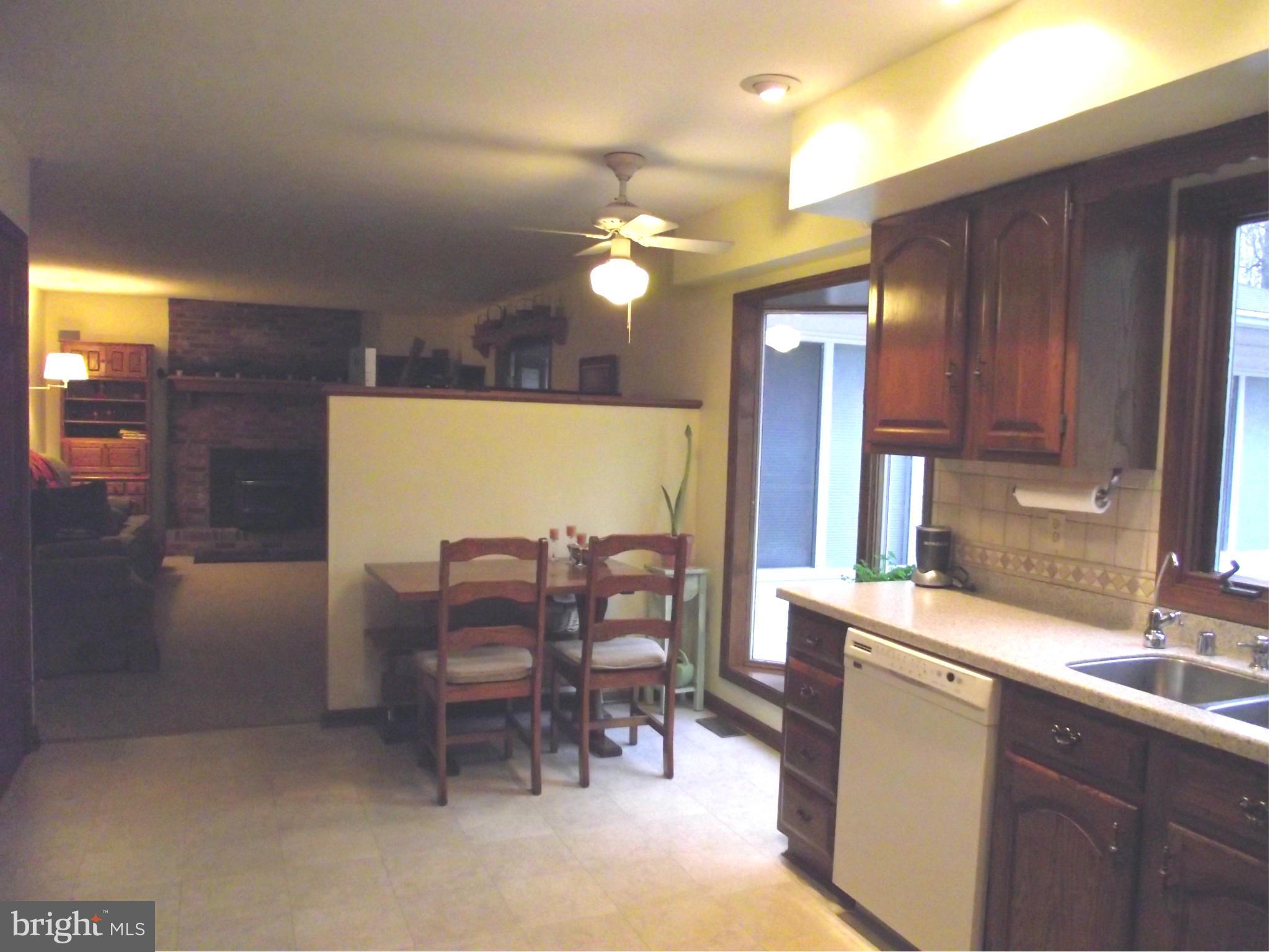 135 Thomas Gantt Road Huntingtown, MD 20639 - Photo 14 of 26 a view of a dining room with furniture and chandelier