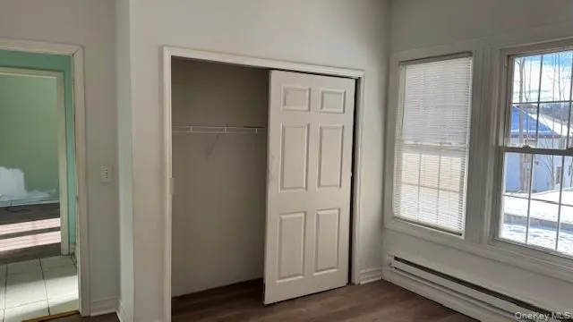 a view of front door with wooden floor