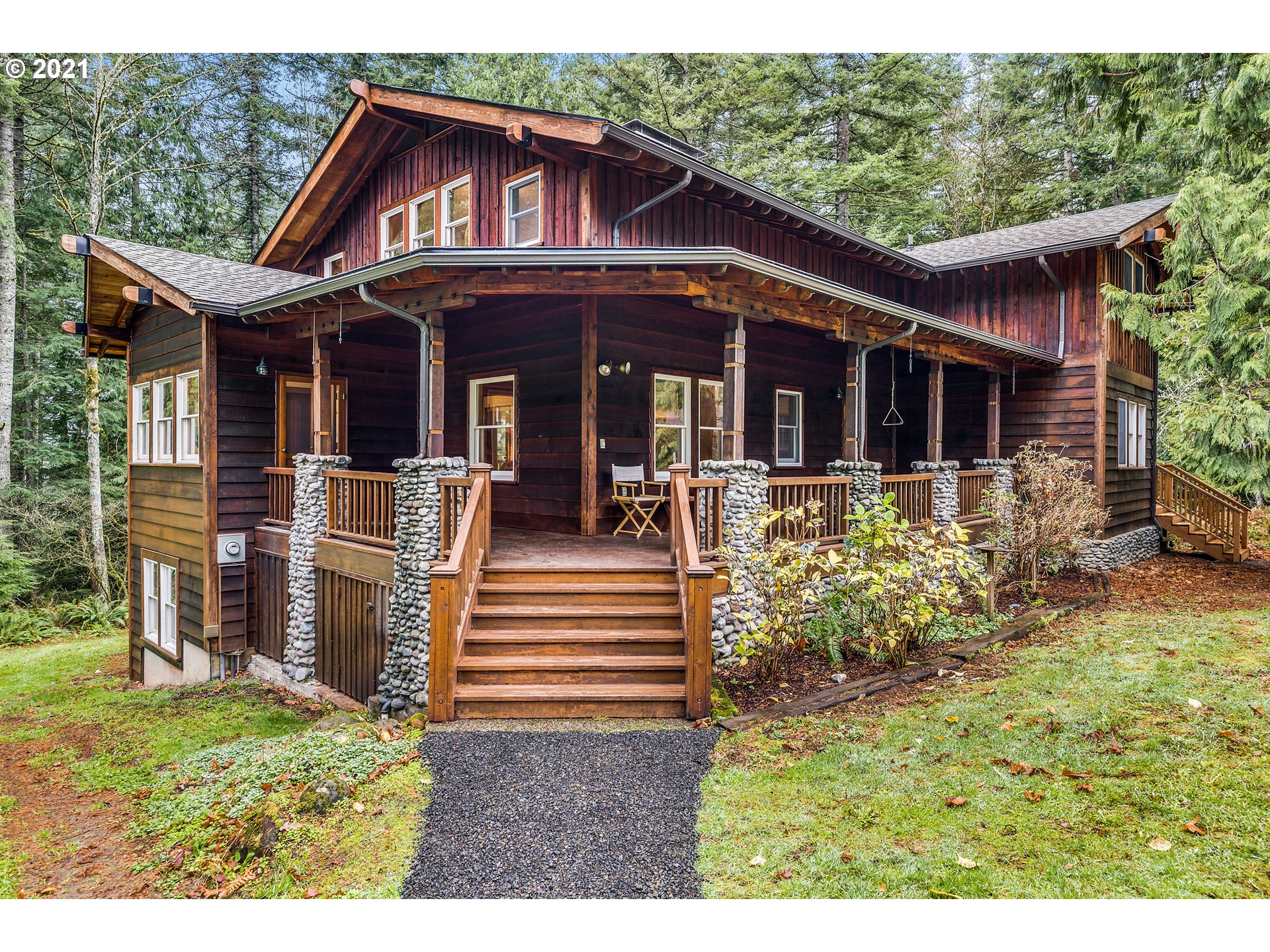 a view of a house with backyard and porch
