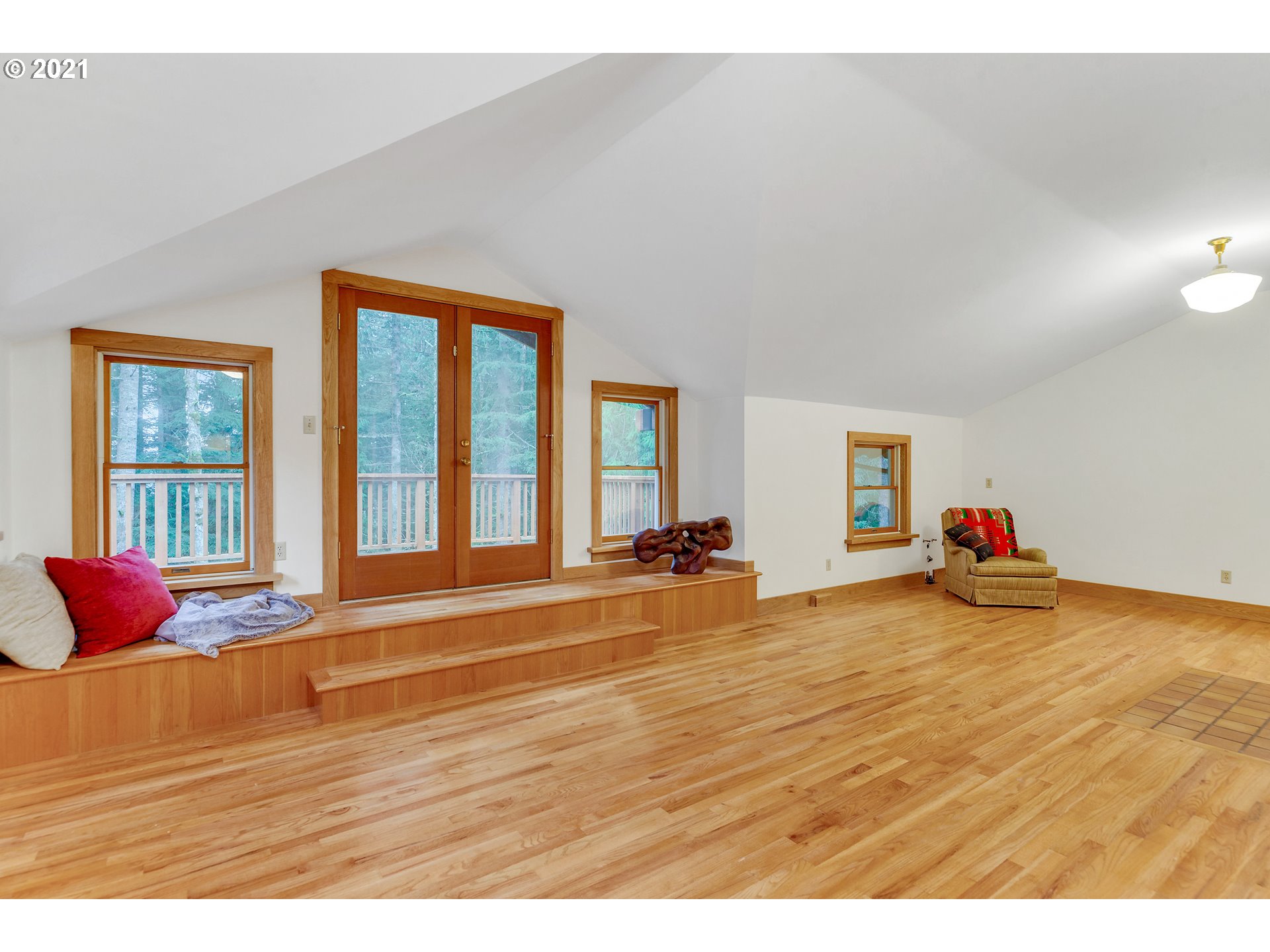 53236 East Marmot Road Sandy, OR 97055 - Photo 14 of 32 a view of a livingroom with wooden floor and a large window