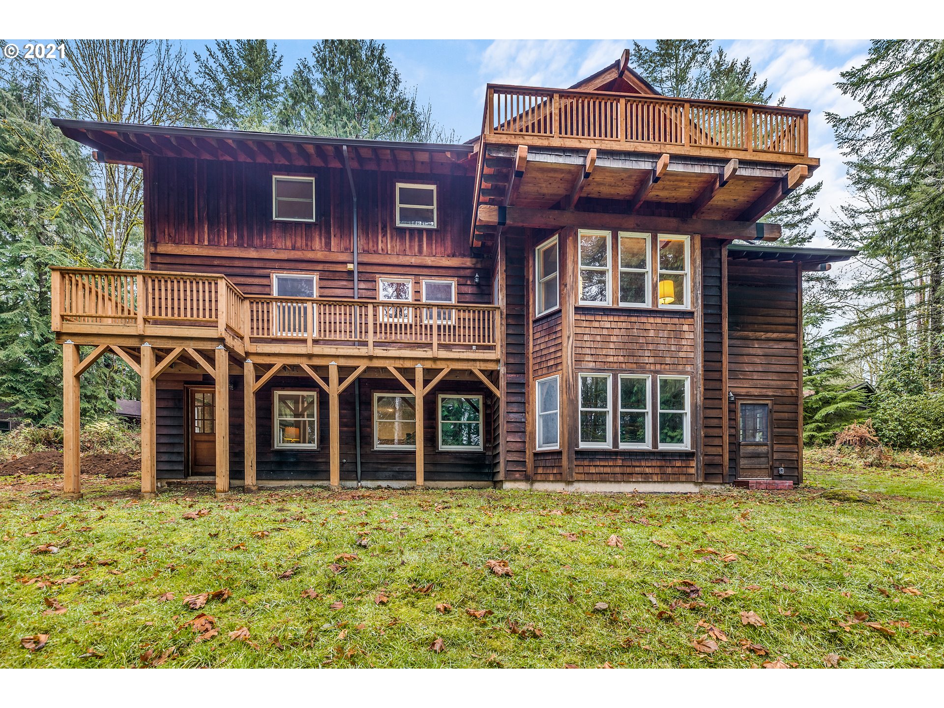 53236 East Marmot Road Sandy, OR 97055 - Photo 23 of 32 a front view of a house with a garden