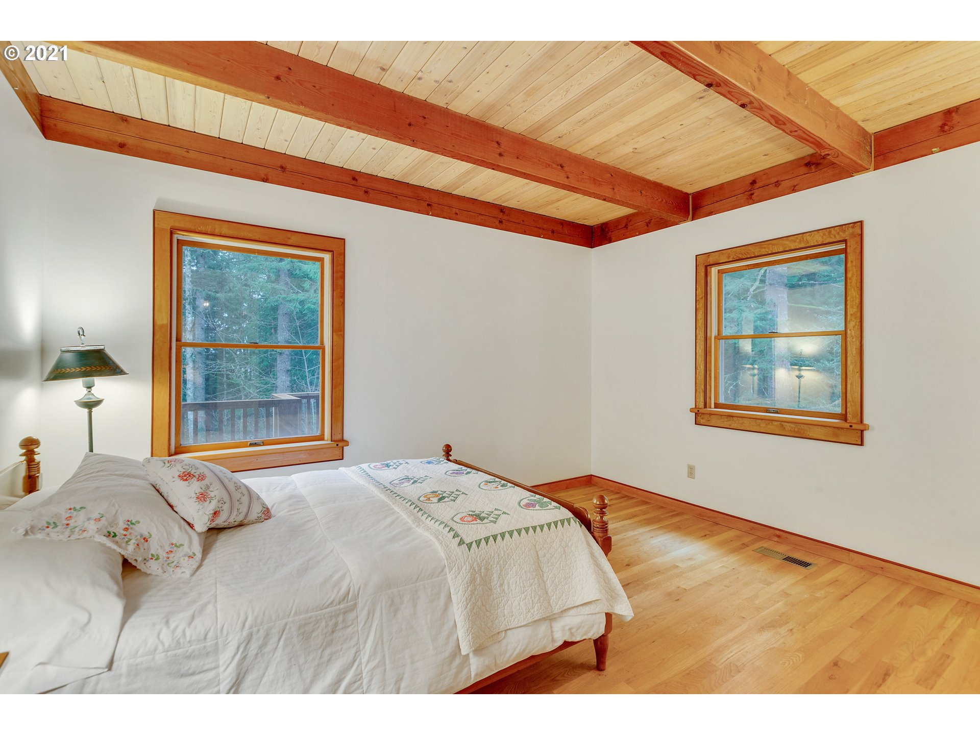 53236 East Marmot Road Sandy, OR 97055 - Photo 10 of 32 a bedroom with a bed and a window