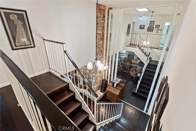 a view of an entryway with wooden floor