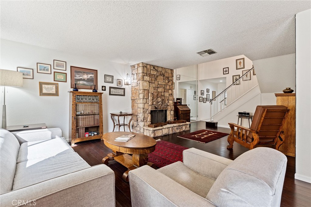 236 Hawk Lane Palmdale, CA 93551 - Photo 17 of 32 a living room with furniture and a table