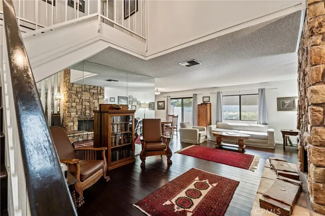 a living room with lots of furniture and a rug