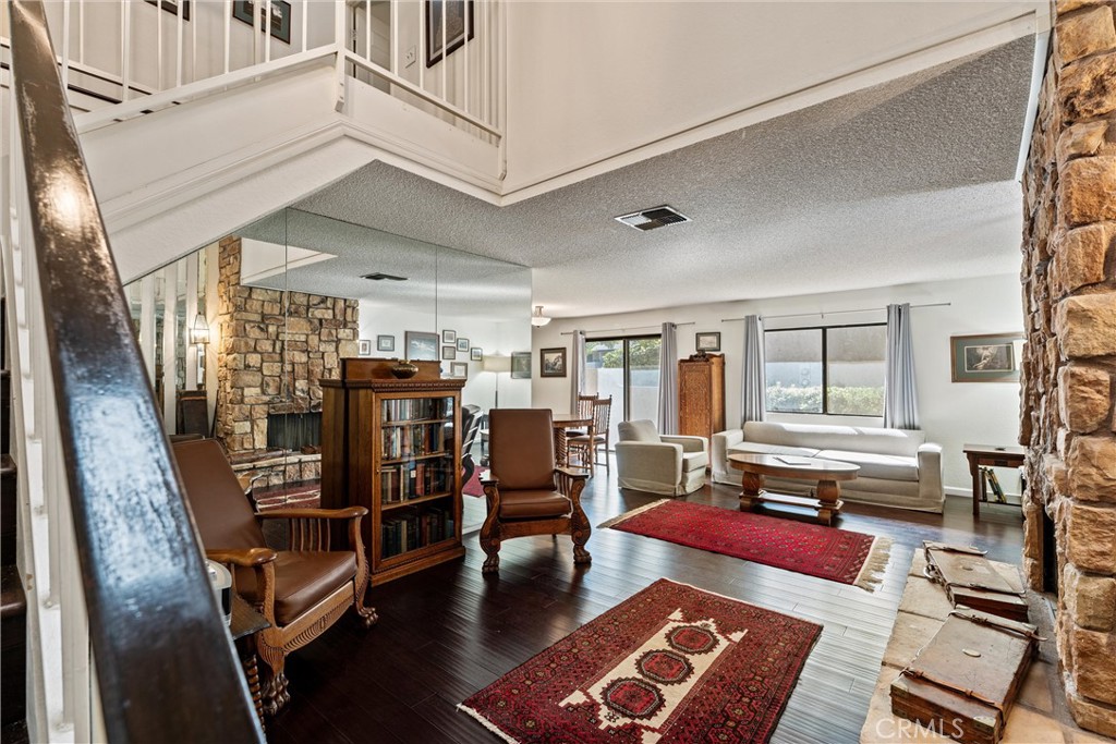 236 Hawk Lane Palmdale, CA 93551 - Photo 20 of 32 a living room with lots of furniture and a rug