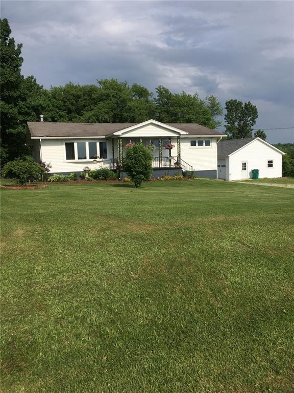 132 Slease Road Kittanning, PA 16201 - Photo 1 of 3 a front view of a house with garden